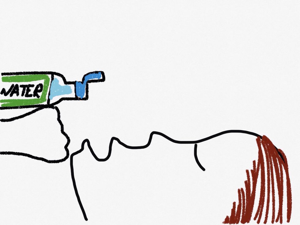 Place the water bottle on top of your fist.