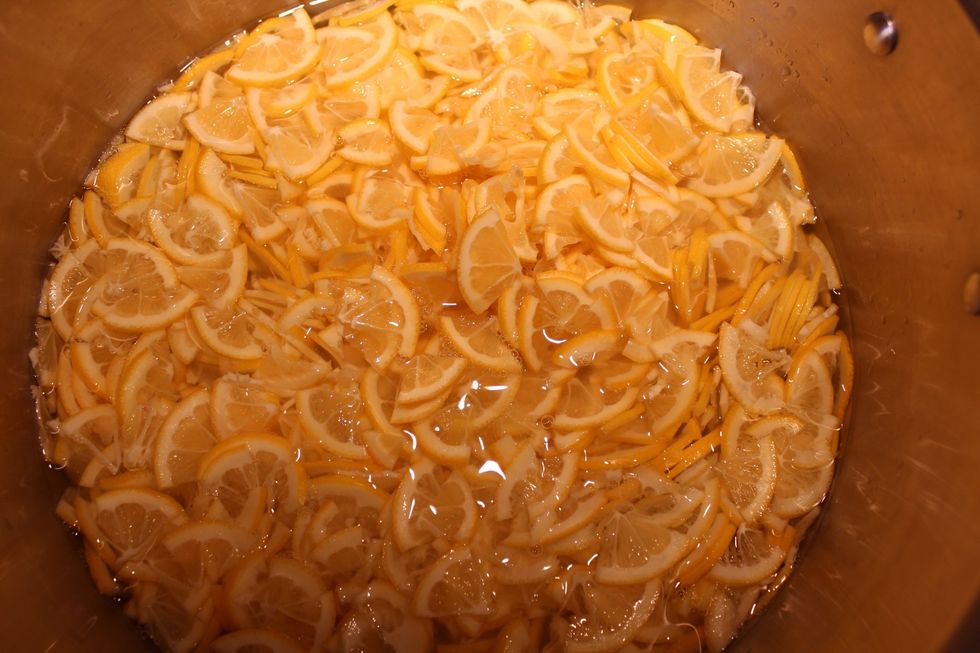 Place the water & lemons in a large stainless steel or heavy-bottomed pot & bring to a boil. While you wait, fill a very large soup pot w/ water almost to the top & set to boil on a separate burner.