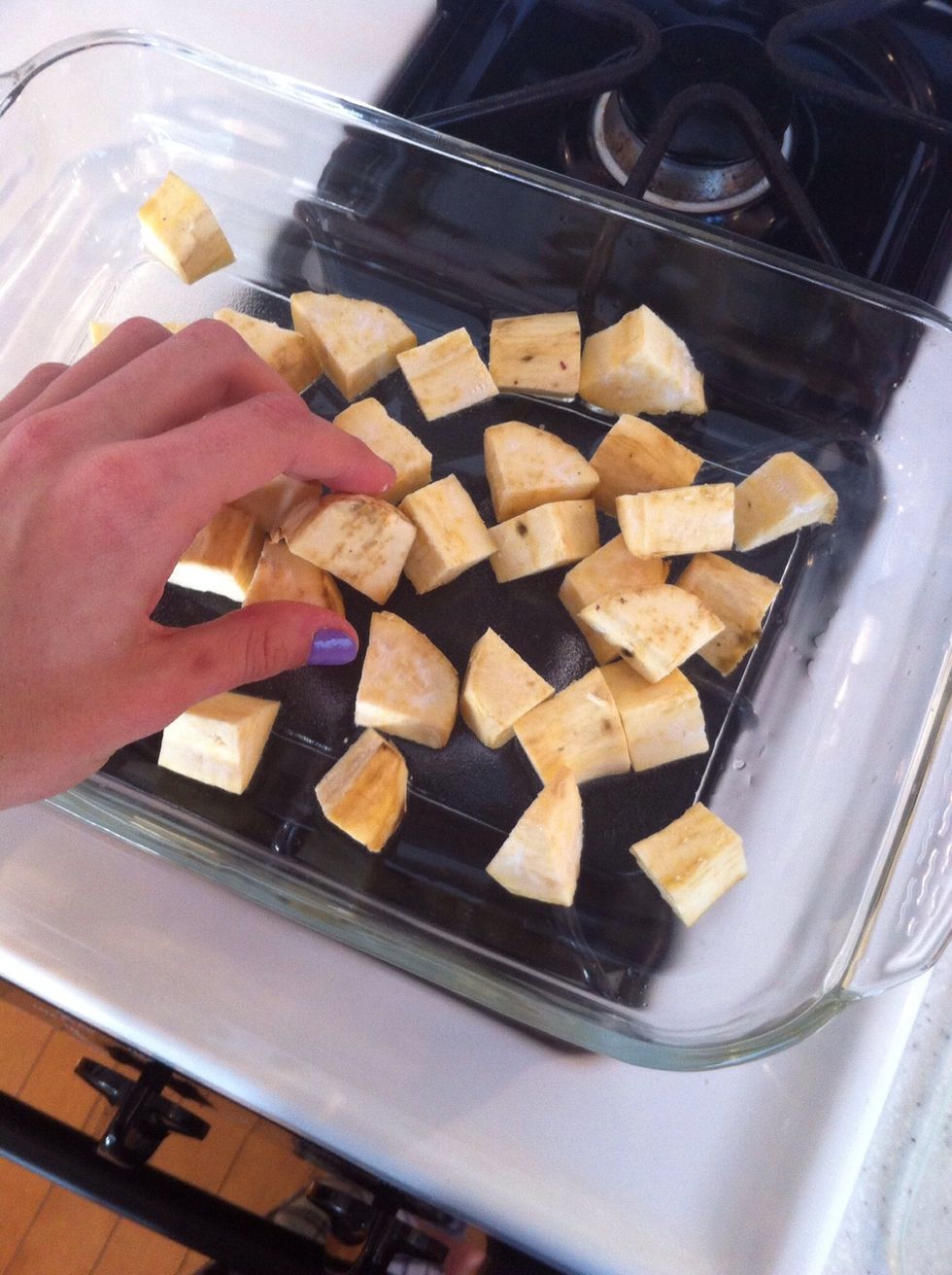 Place the wedges in the coconut oil covered dish. Toss the wedges around in the coconut oil, completely covering them with the oil.