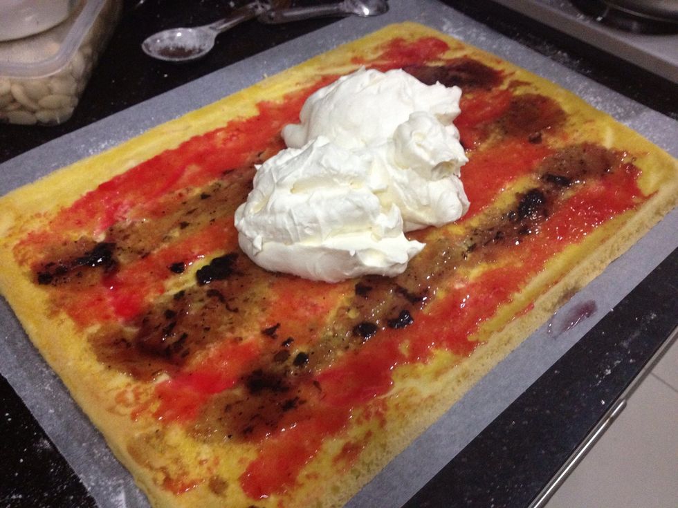 Place the whipped cream on the cake.