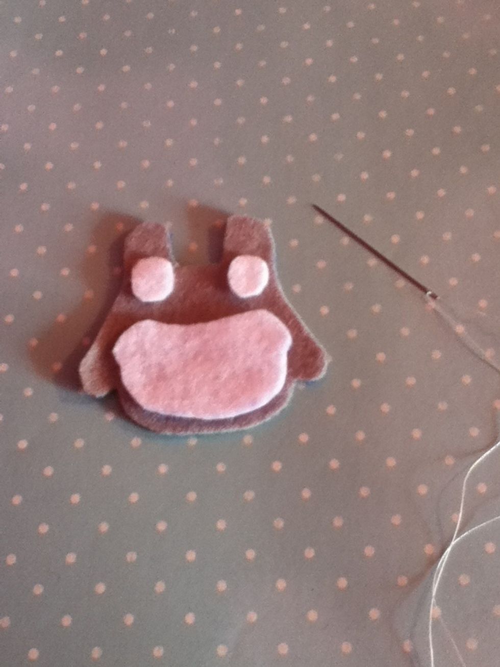 Place the white pieces onto one of the grey pieces and see on using a fell stitch