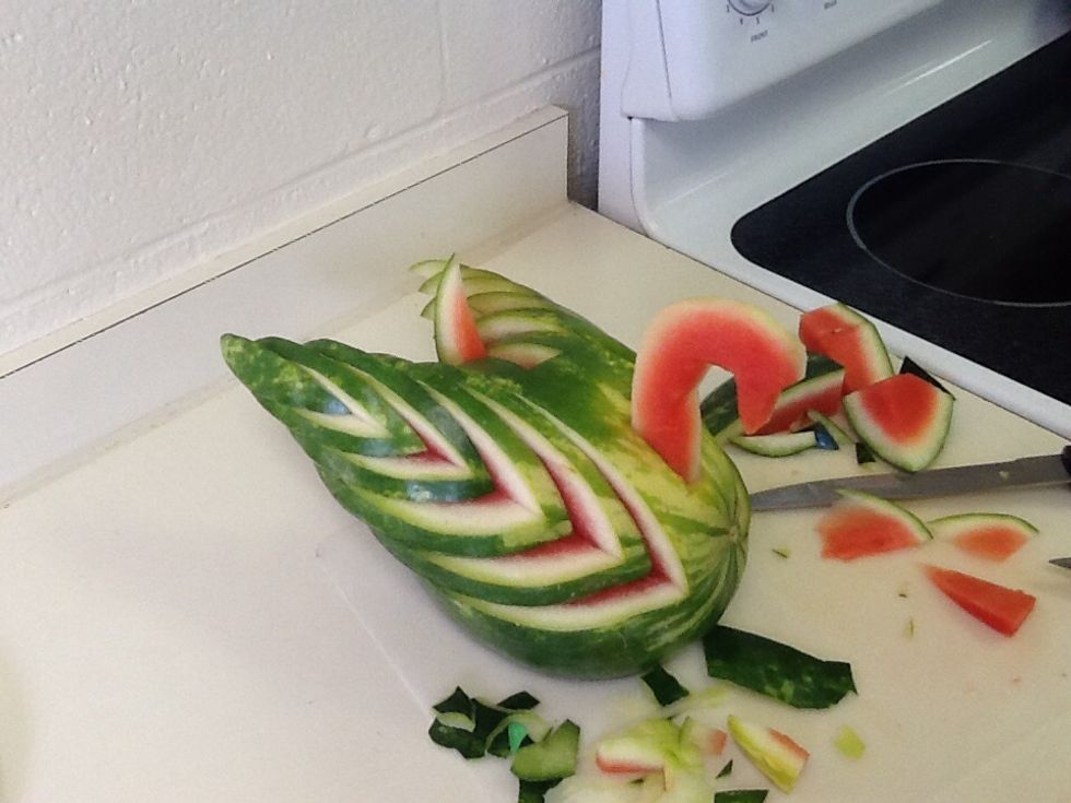 Place the wings on first, pushing each section back about the same distance making sure they won't fall off. Then place the tail and the head in their respective holes.