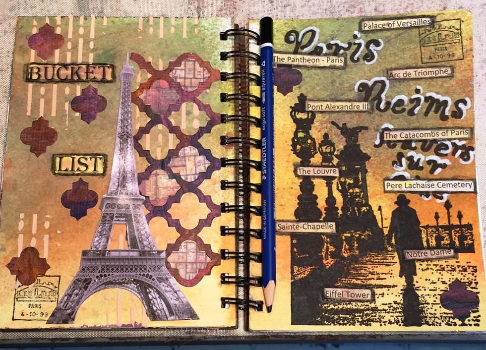 Place the works Bucket List on the left and the places on the right.  Outline them with a watercolor pencil (I used a black Staedler ergosoft Aquarelle pencil) and then blend with a wet brush.