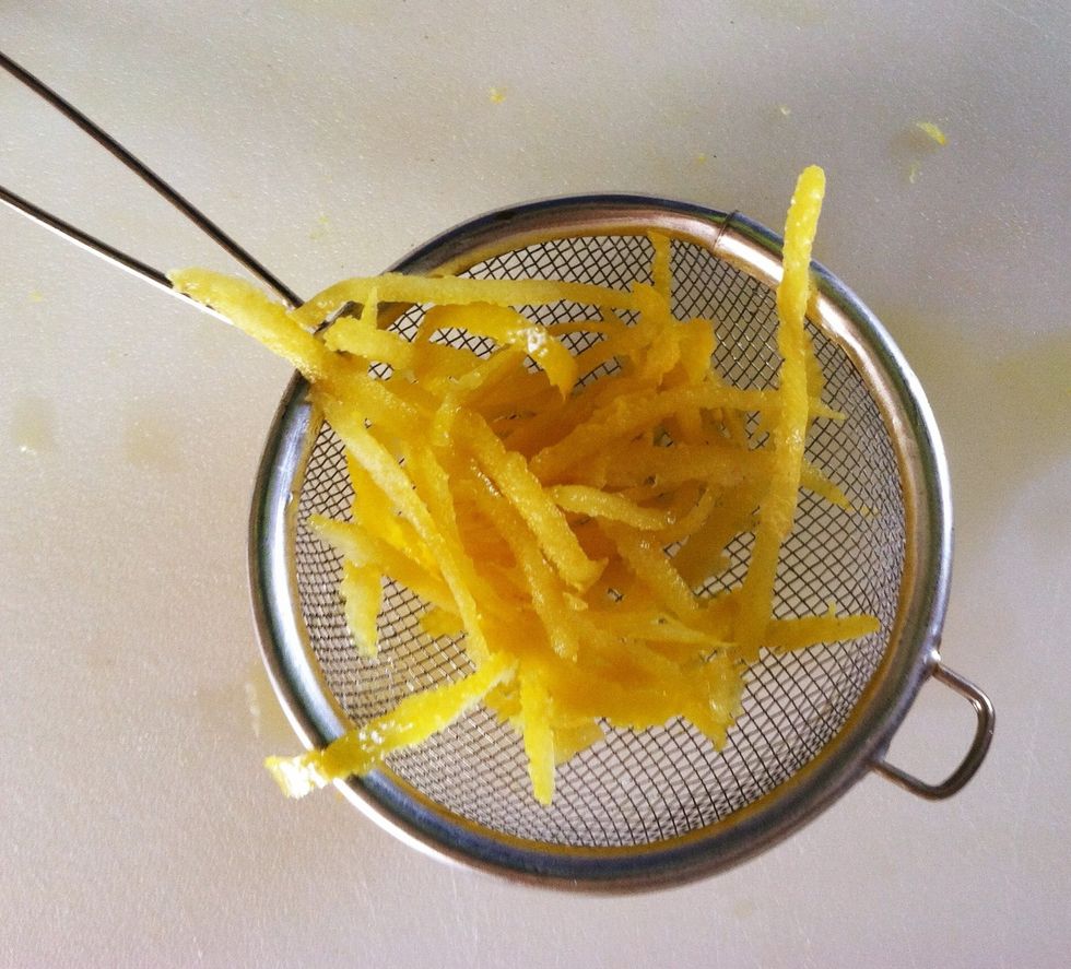 Place the zest into a strainer/sieve and dip into boiling water. Leave for 30 SECONDS and then remove. Discard the boiling water.