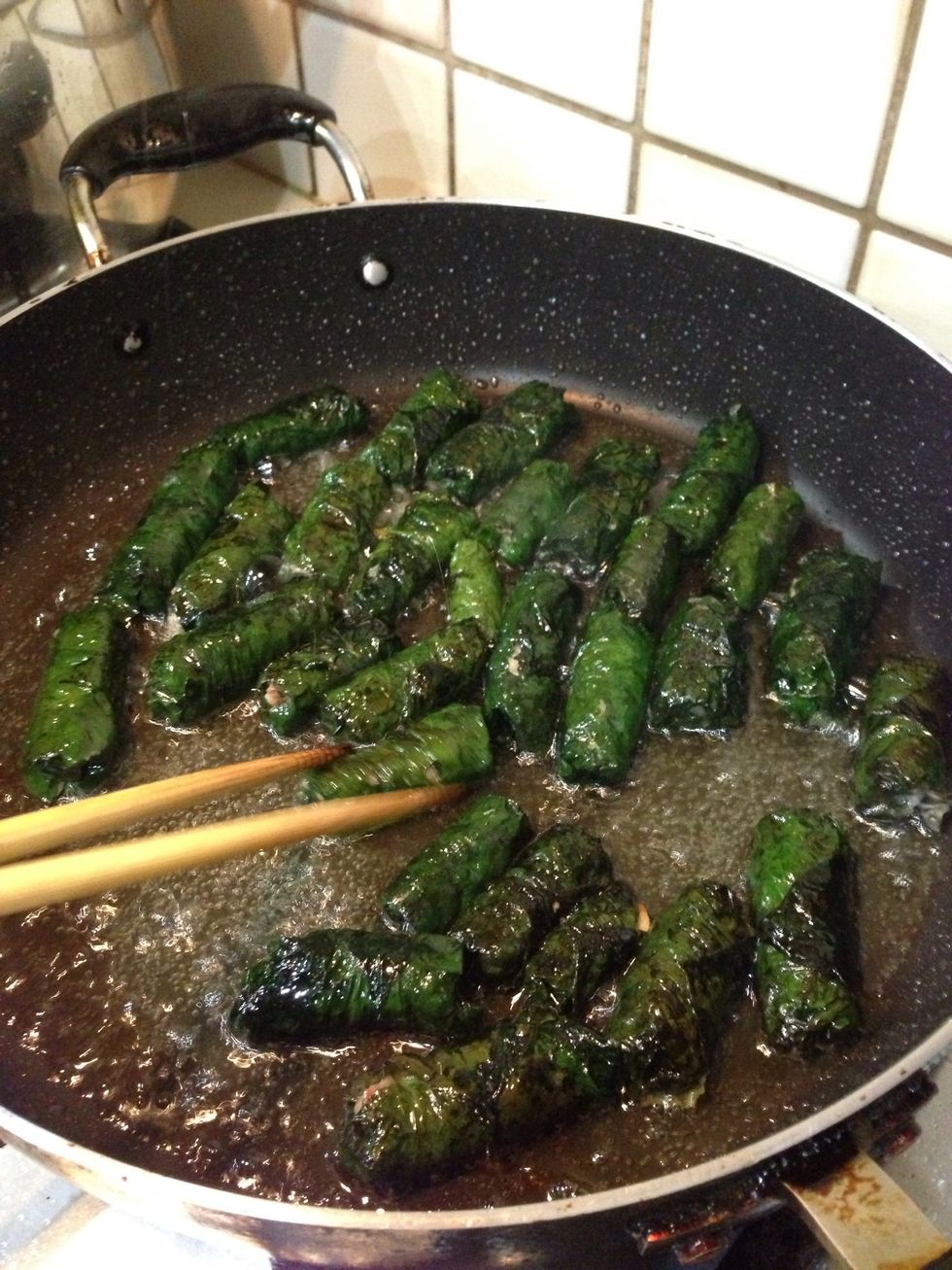 Place them in the pan/pot and turn the heat to low! The leaves can burn very fast and it's important that the meat is cooked before the leaves burn. The smell is amazing!!!
