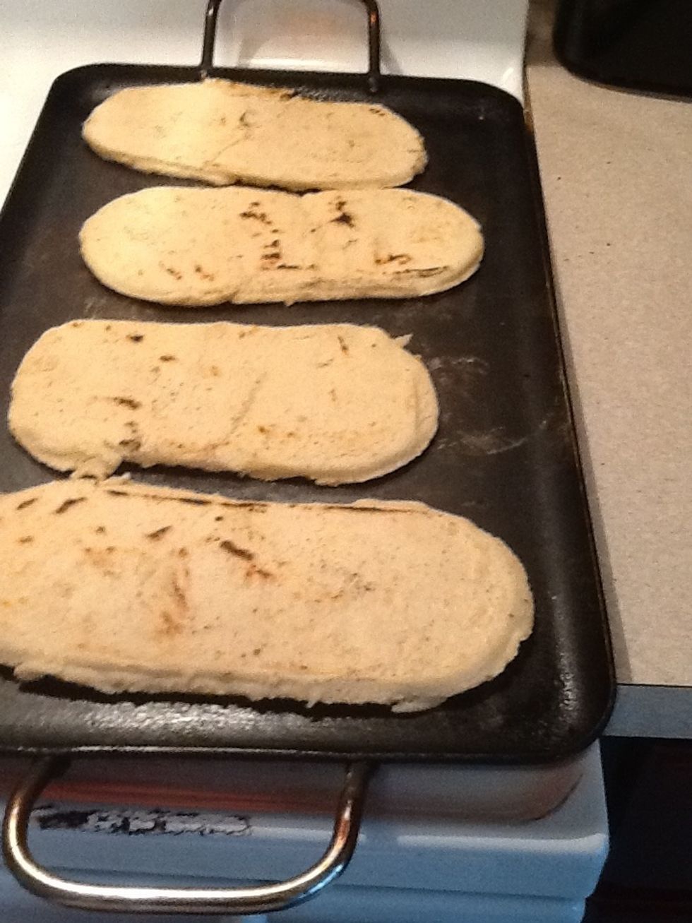 Place them on a hot grill once they come ti a golden brown flip them