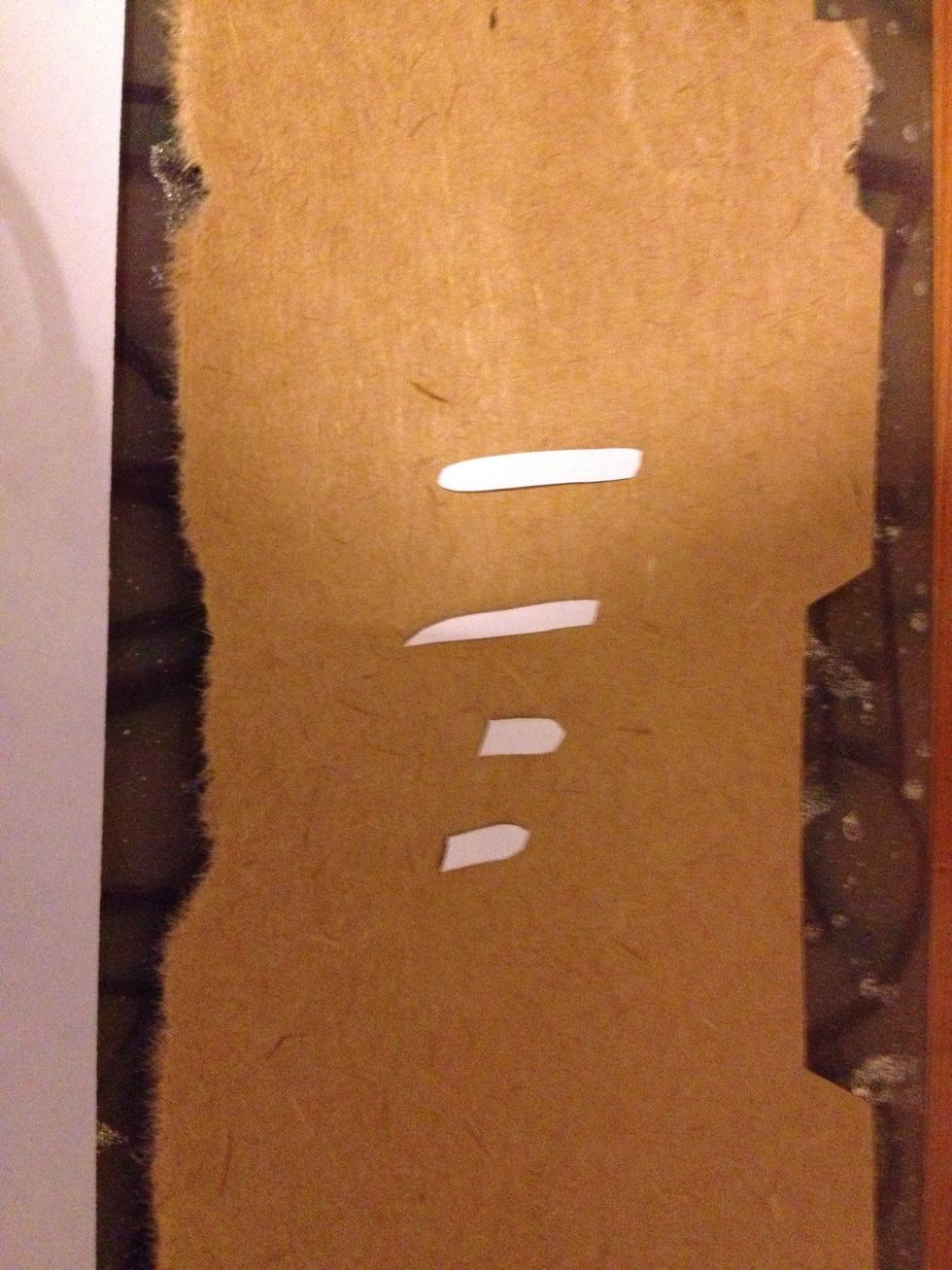 Place them on a pc of cardboard so u dont get adhesive on ur fingers. Also make sure u flip them over and spray the back so when u put them back they're facing the right way.