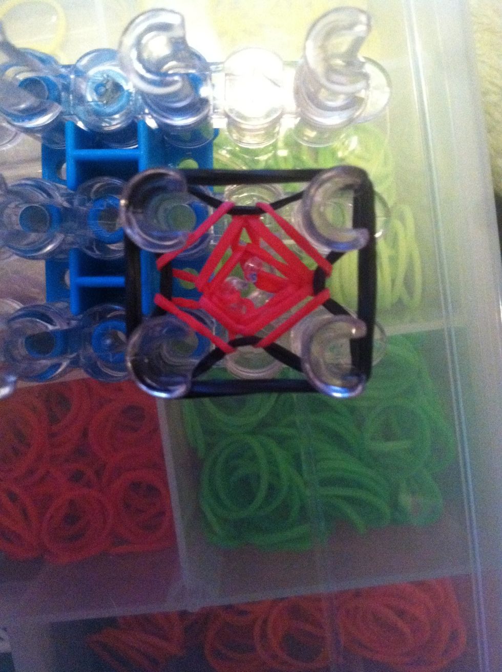 Place them on the four pegs and loop the bottom two back bands over them