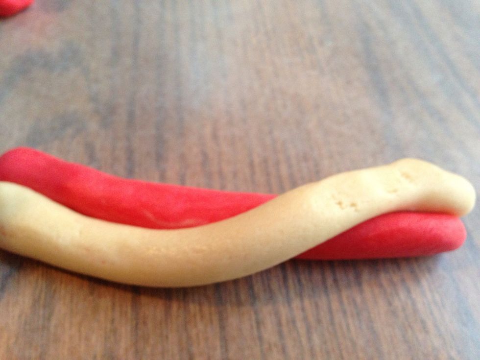 Place them side by side and start to twist