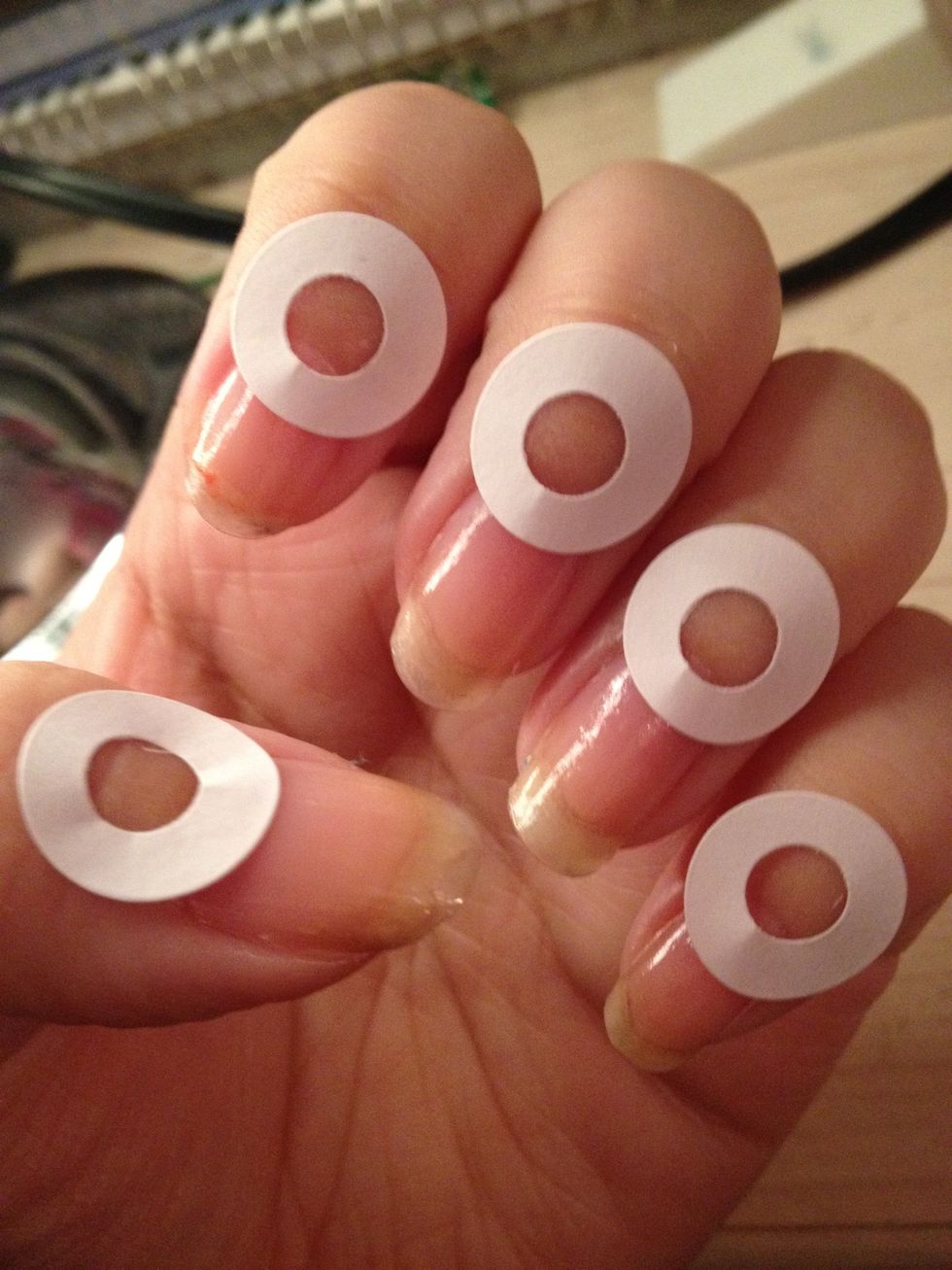 Place these at the bottom of your nail depending on how big you want the half moon to be
