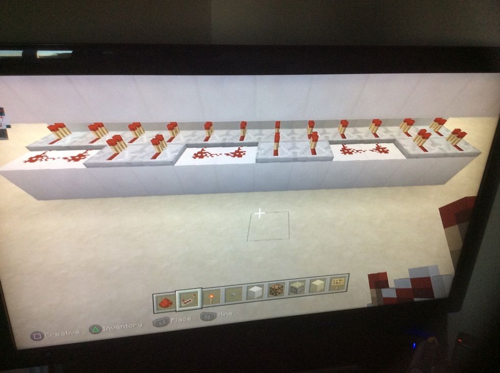 Place this pattern of redstone and repeater on every row of blocks.