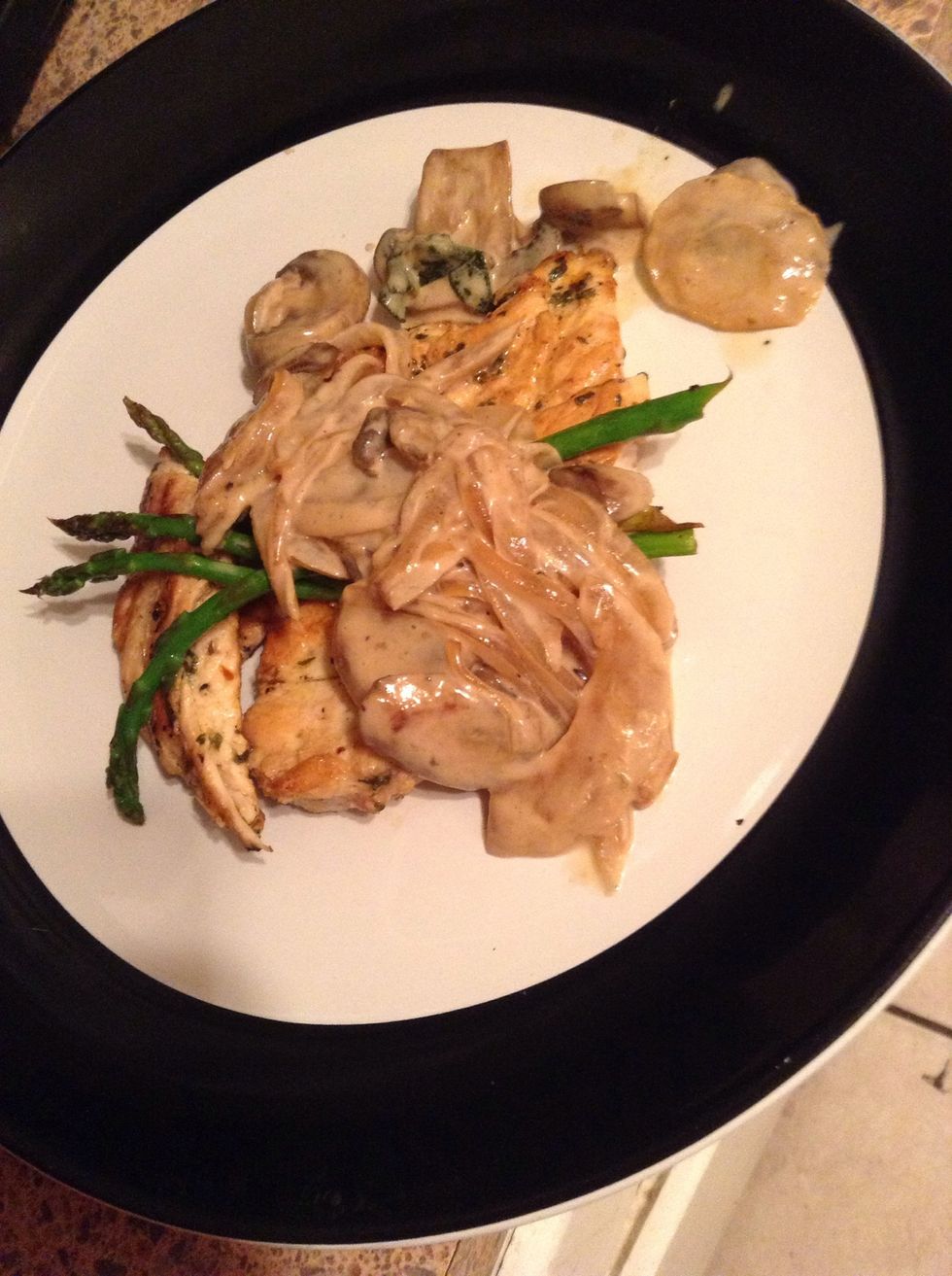 Place three asparagus and a spoon of sauce on top of chicken breast as if you work in a five star restaurant!