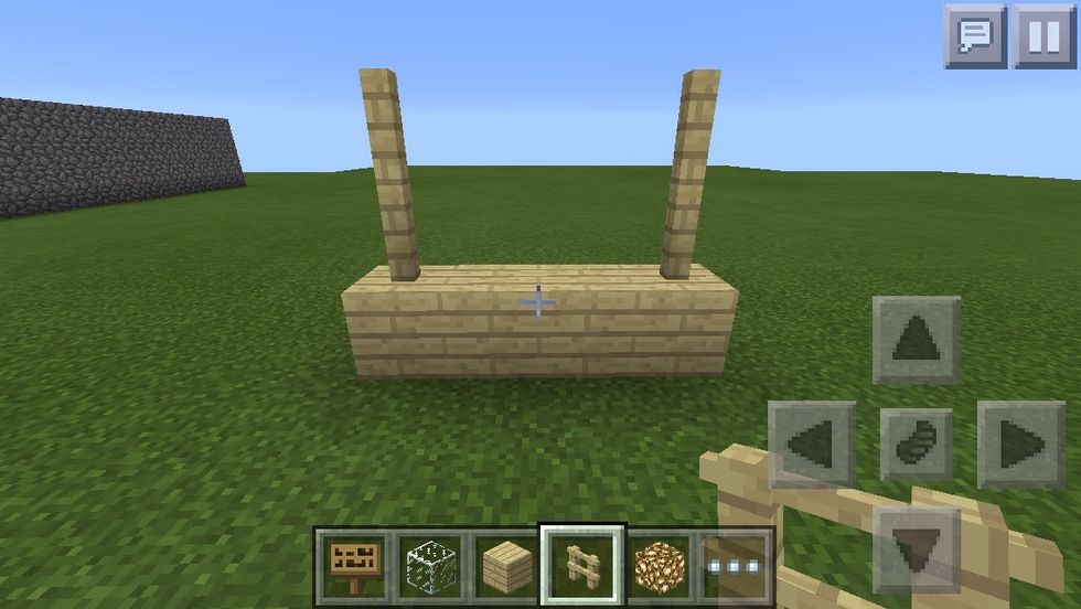 Place three planks in a row,stack two fence poles on each side as shown
