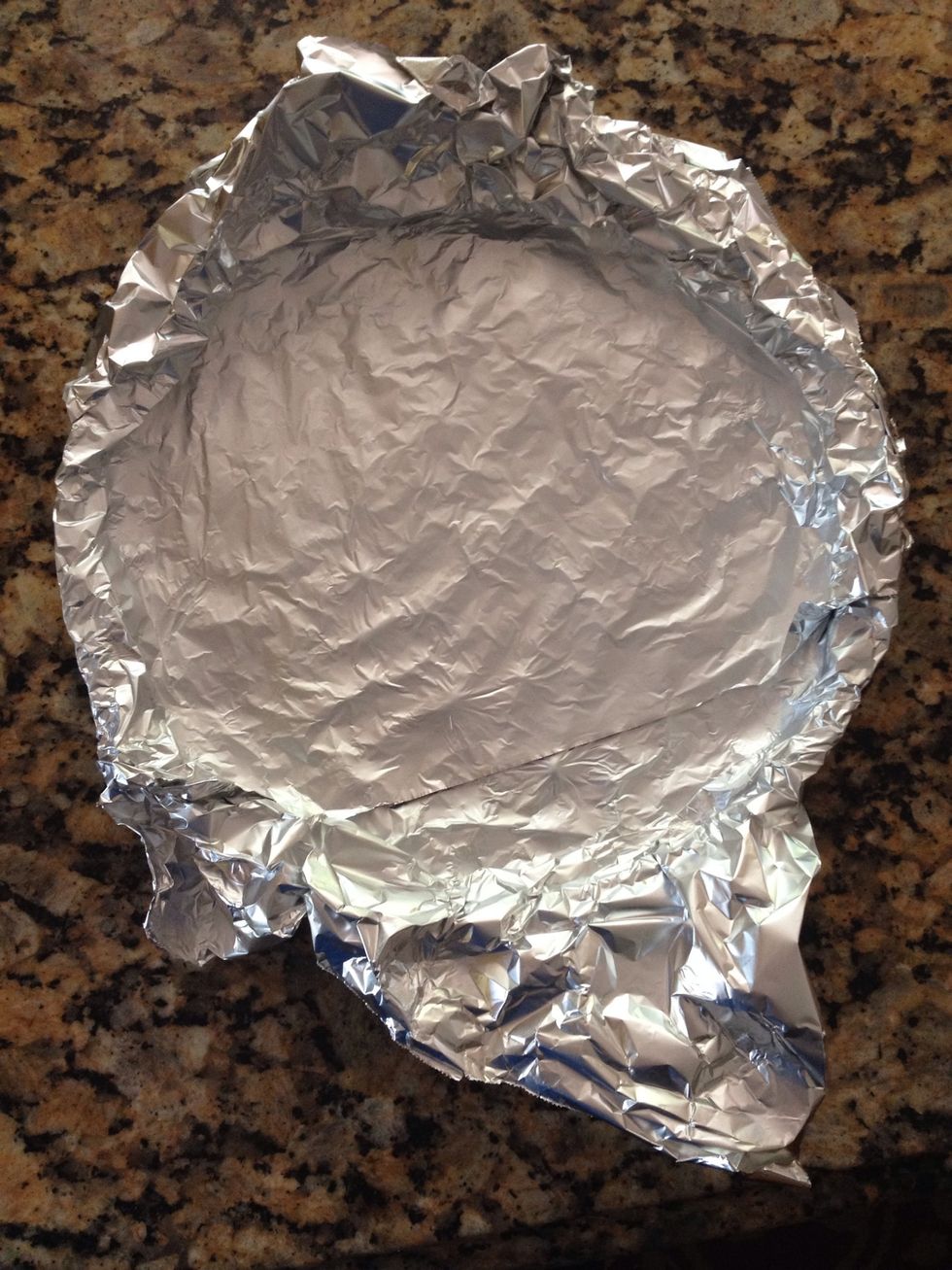 Place tin foil all over and cover well. Then place in freezer for about 30 minutes. While it's getting cold, preheat oven to 375\u00b0