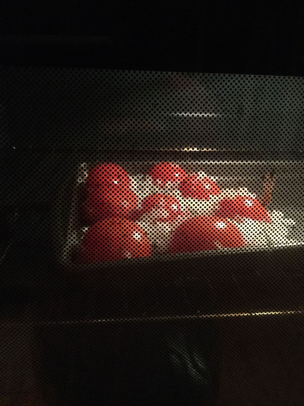 Place tomato halves, onion, and garlic in a single layer on the prepared baking sheet. Stirring occasionally, roast 10 to 15 minutes in the preheated oven (450 degrees), until evenly browned