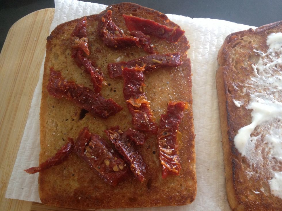 Place tomato on the bread with the vinaigrette. (I forgot to buy tomato so I used sundries tomato). Put salt and pepper on top to taste.