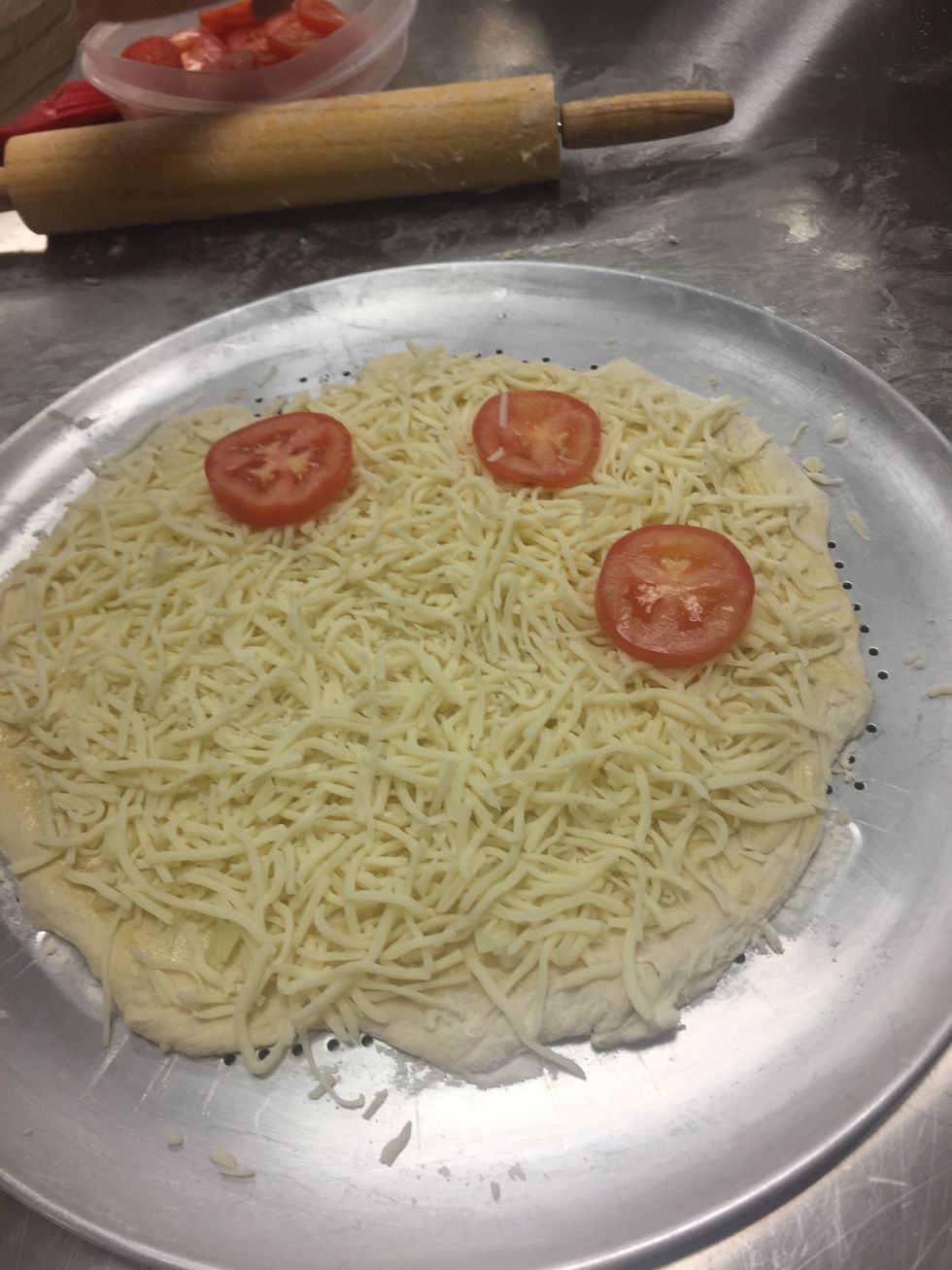 place tomatoes on top of cheese