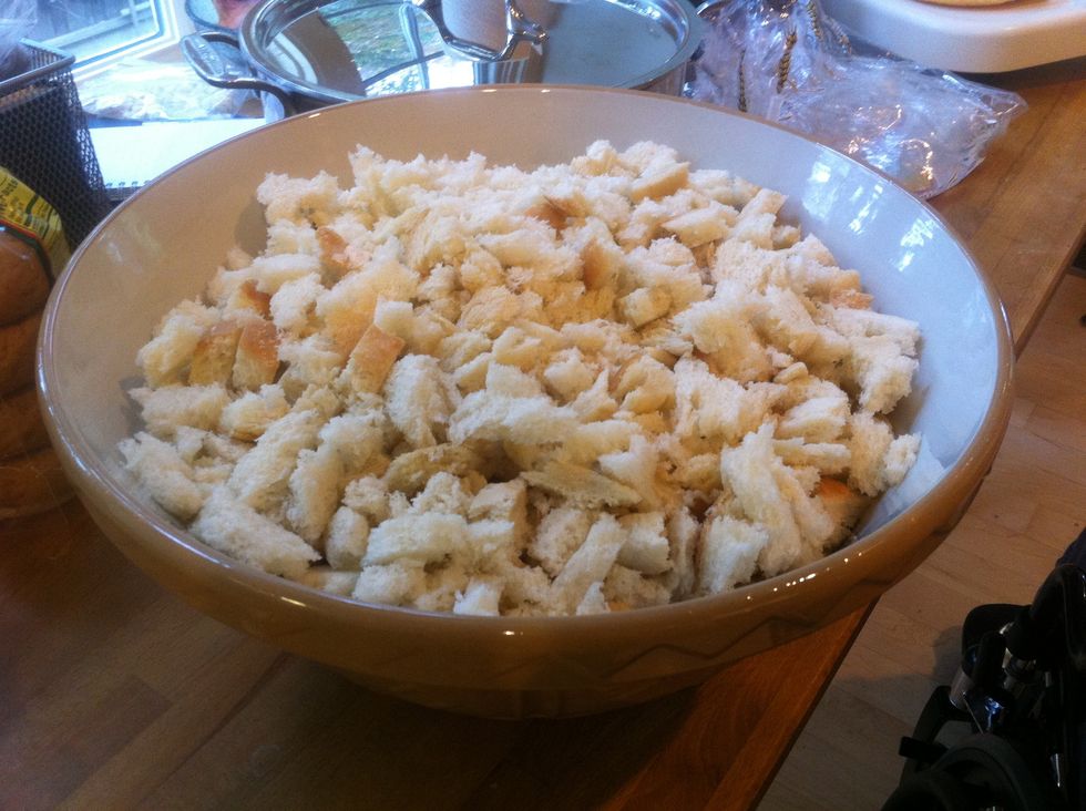Place torn bread into the largest bowl you own.