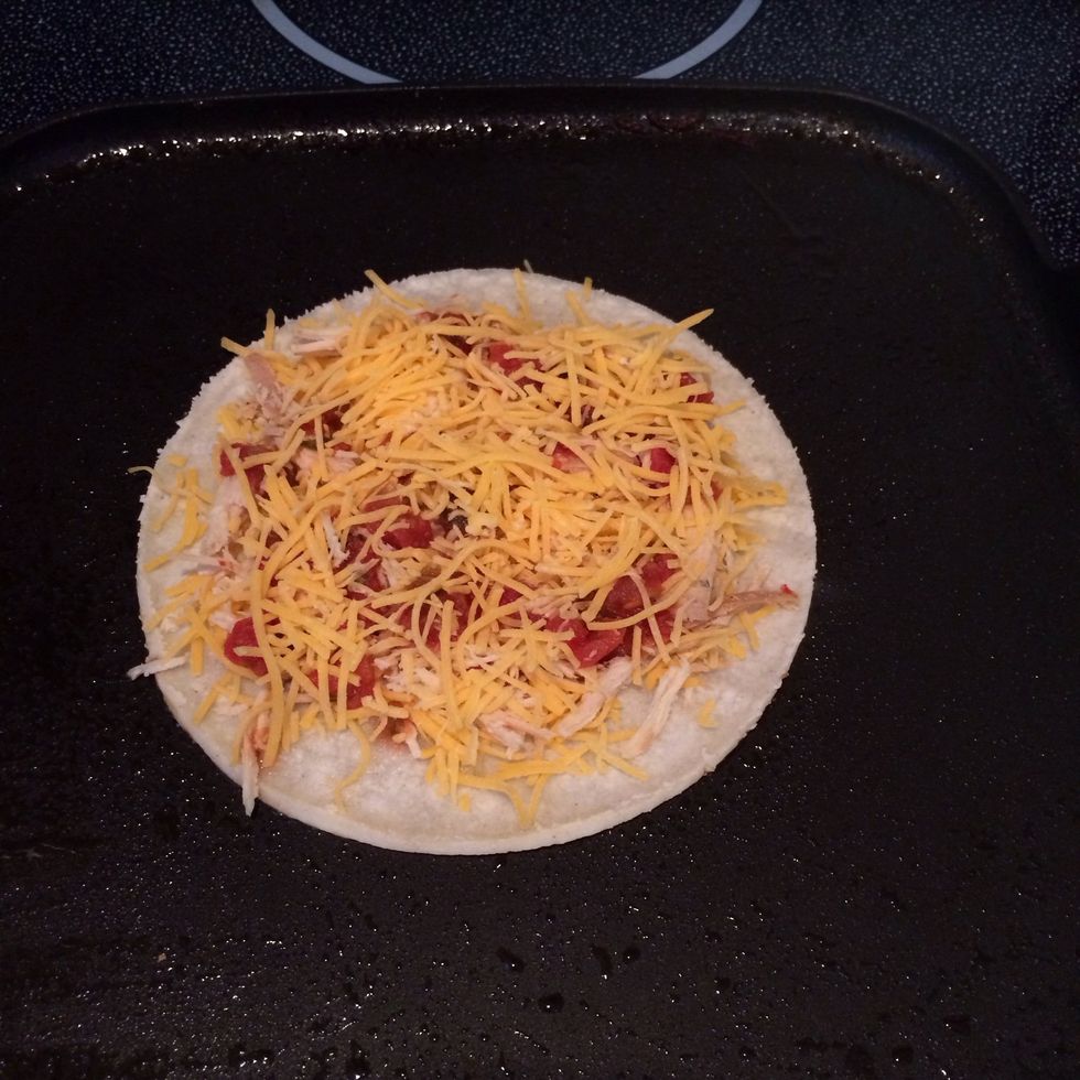 Place tortilla with filling on hot pan.
