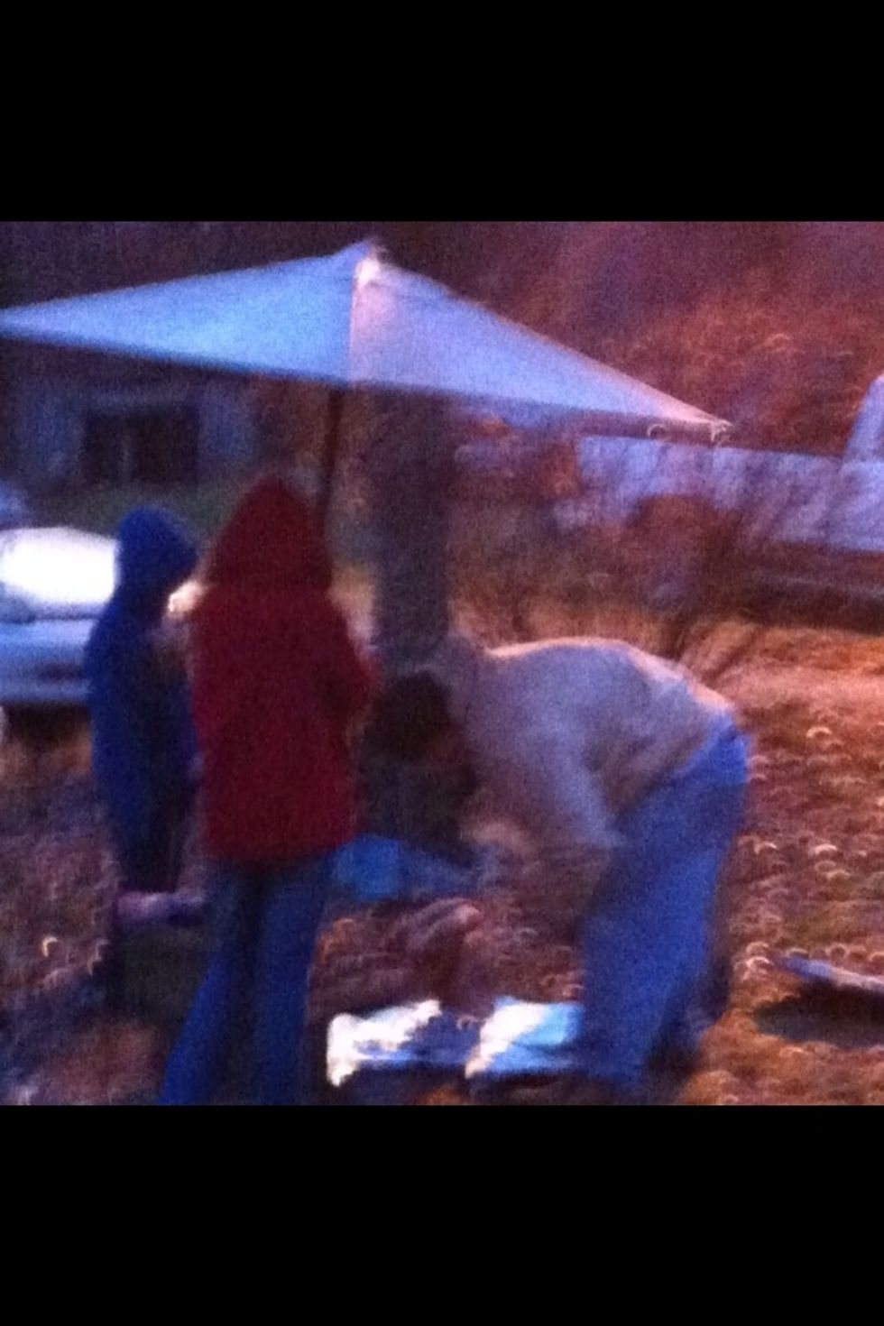 Place turkey standing up on the foil covered spike.