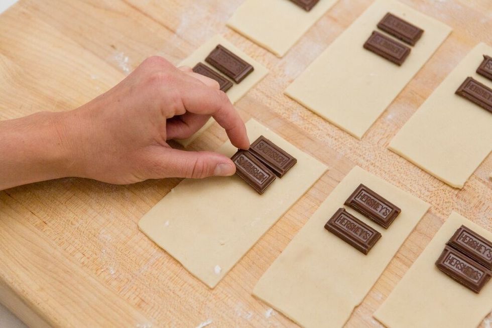 Place two Hershey's chocolate pieces onto each crust rectangle.