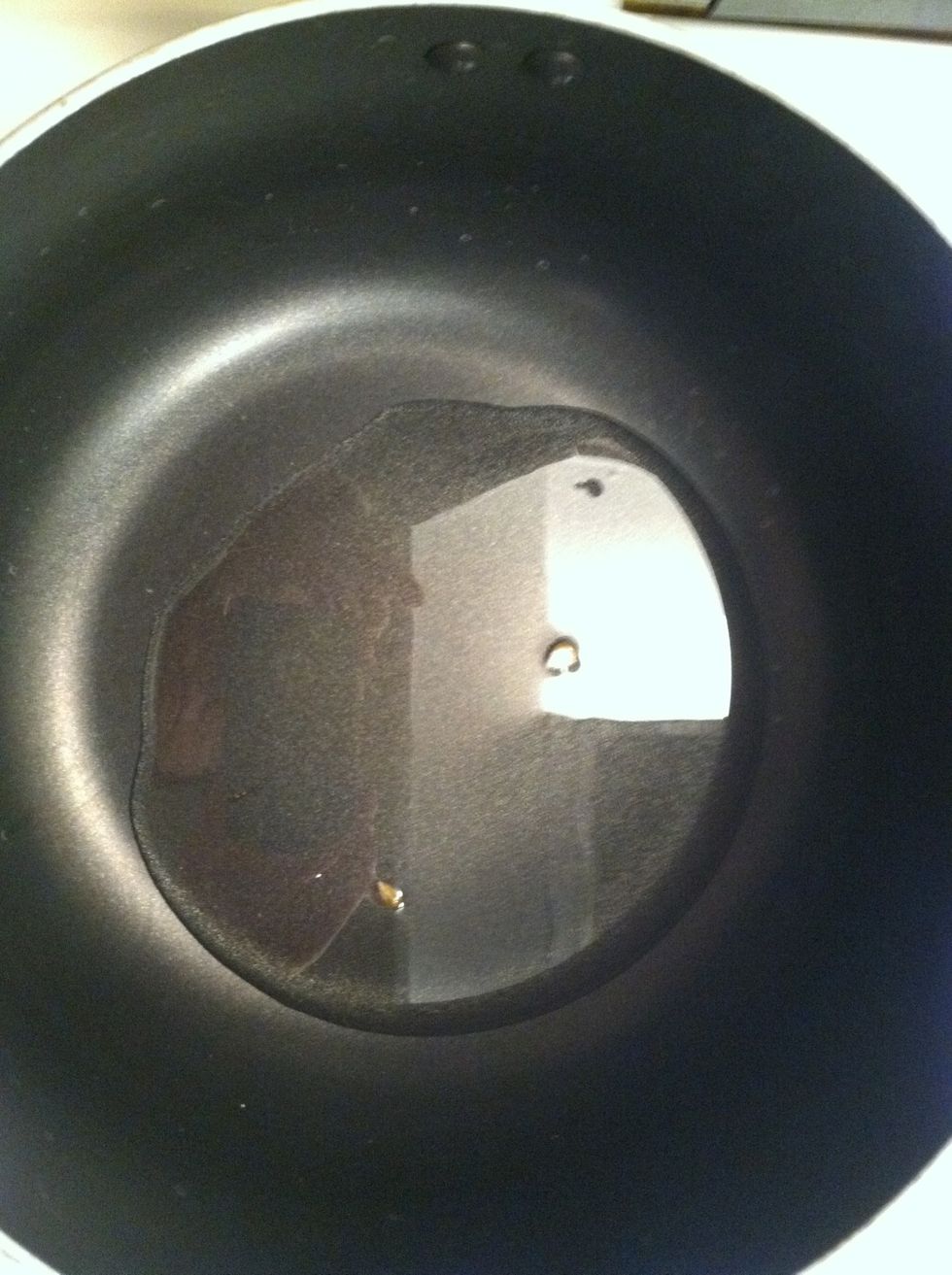 Place two kernels in the pan as the oil heats and wait for the kernels to pop so you know the oil is hot enough. Warning: hot, splashing oil is dangerous, so keep the pan covered