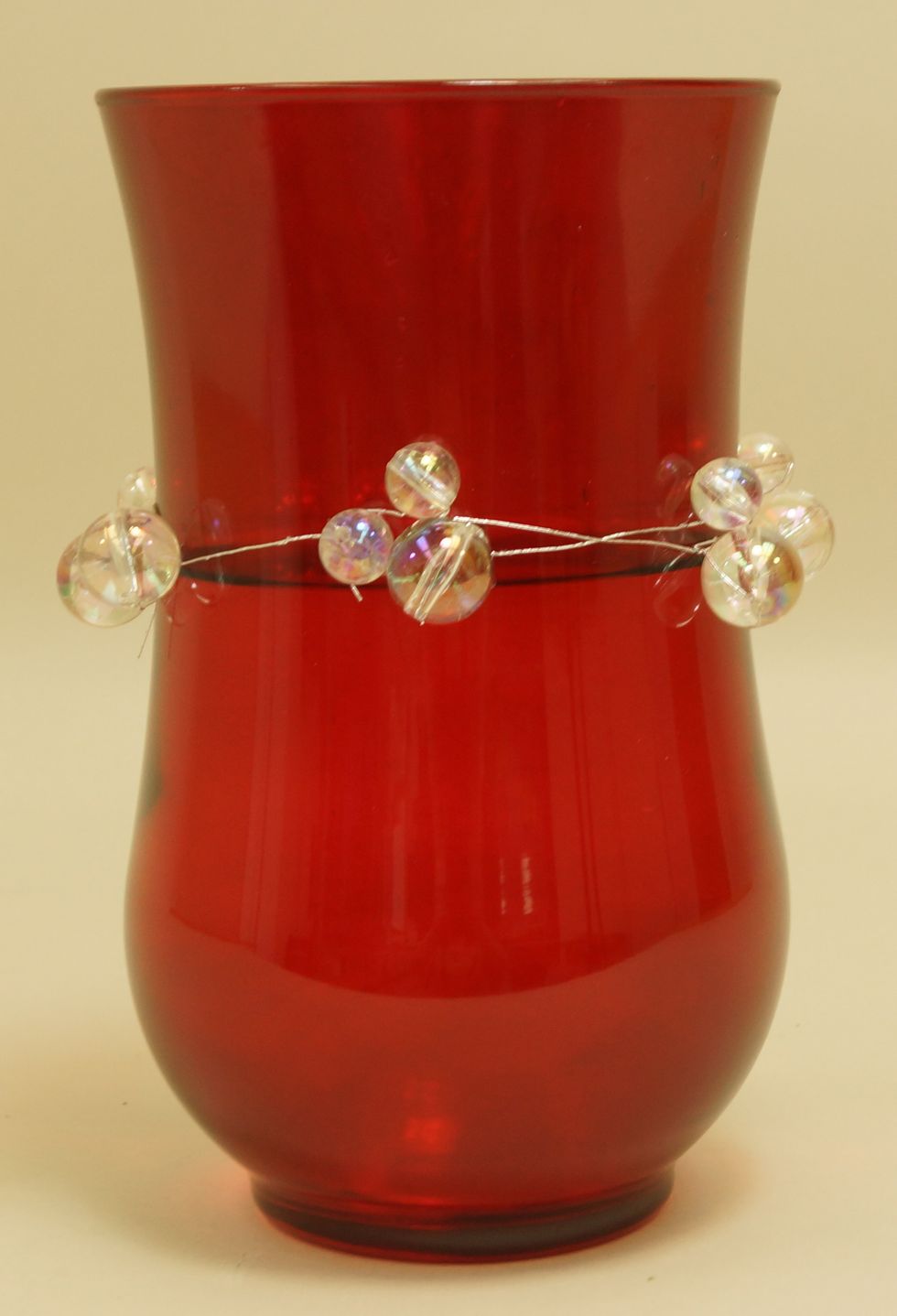 Place Uglu Dashes around vase to hold Mega Beaded Wire in place. Be sure to peel off paper on both sides of dashes to adhere.