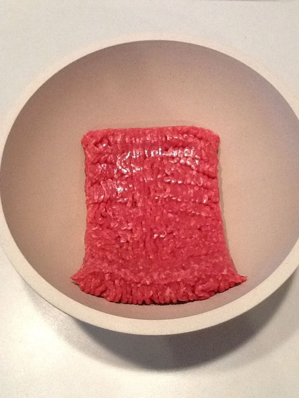 Place uncooked hamburger meat in medium sized bowl.