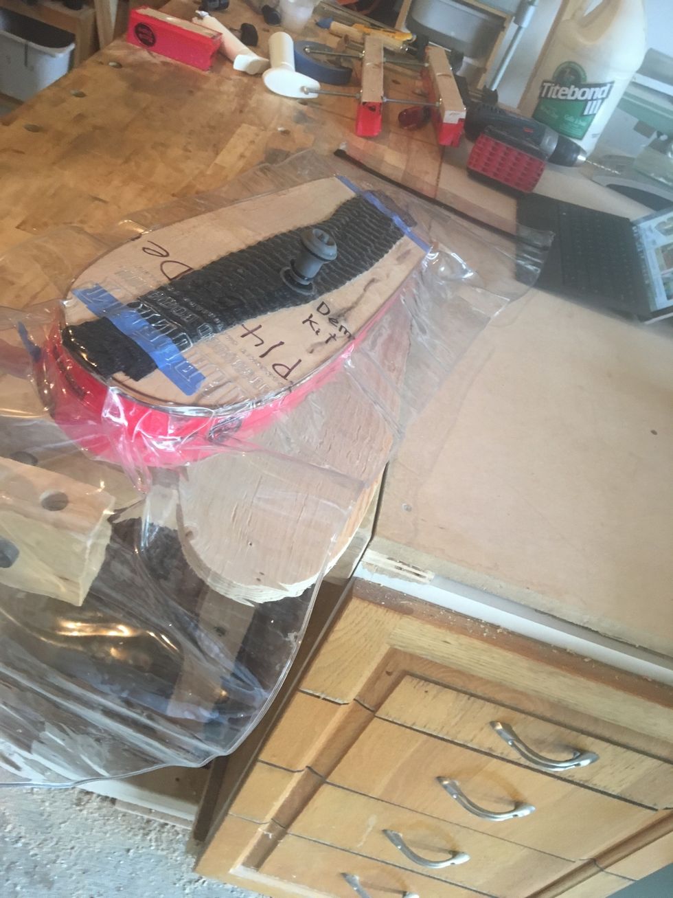 Place vacuum bag on plywood mold.