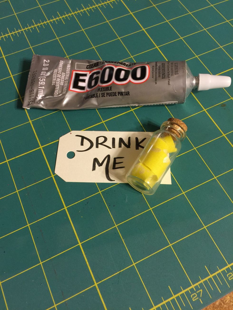 Place vial onto the small strip of E6000 adhesive and set aside.