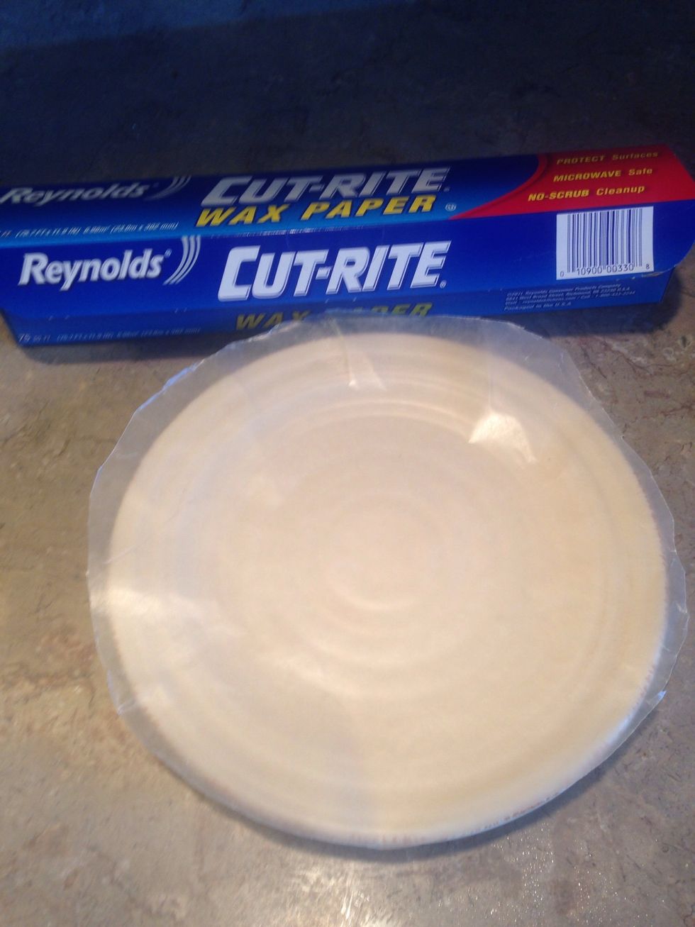 Place wax paper on a plate. Cut excess paper off if you'd like. This helps them stay as balls and not stick to the plate.