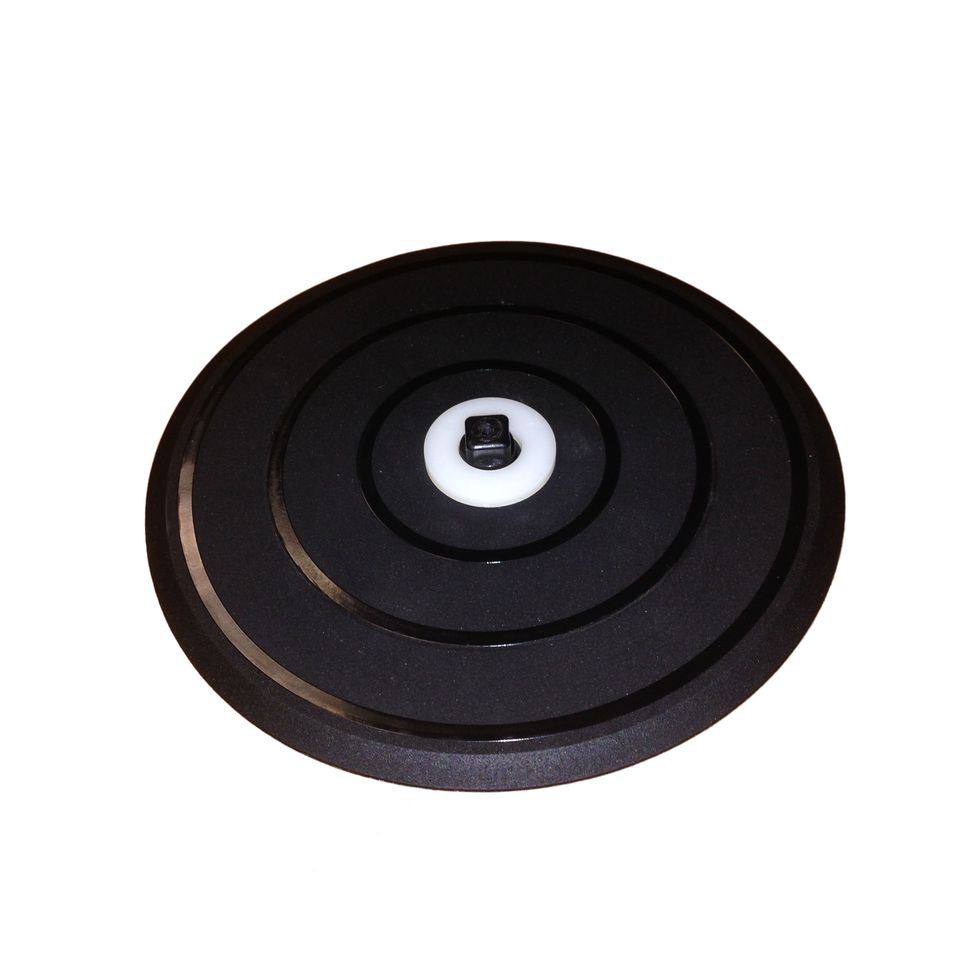 Place white spacer ring onto bottom disc pad as shown