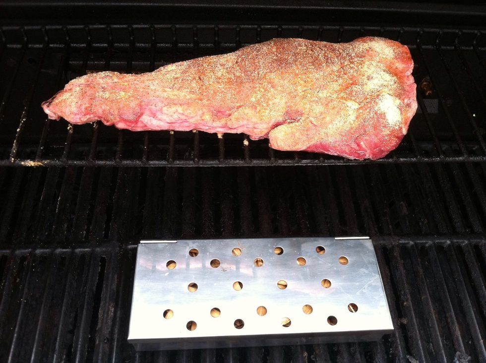 Place wood chips in a smoker box (or aluminum foil with vent holes) on the grill. Place the tri-tip on the warmer rack (indirect heat).
