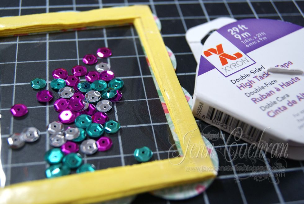 Place Xyron 1/4" High Tack Tape around the entire foam frame back.