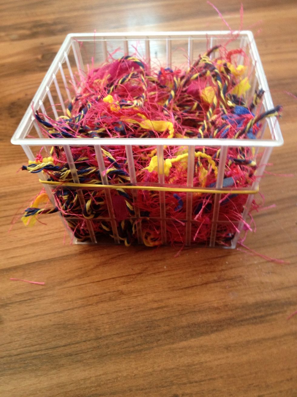 Place yarn bits into fruit basket.