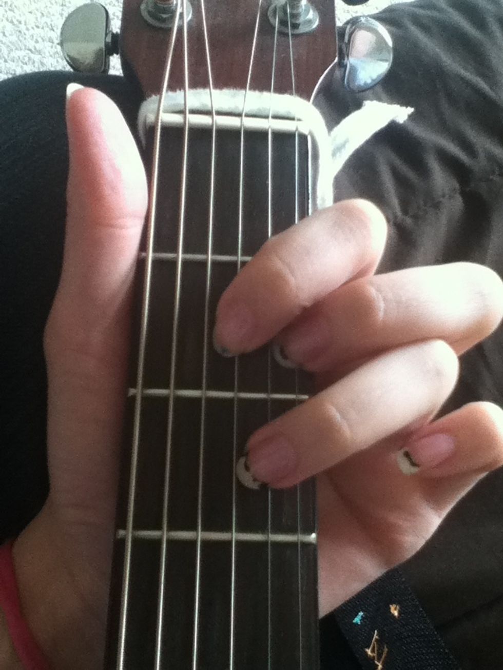Place your 3rd finger on the 5th string on the 3rd fret (that is a "D")