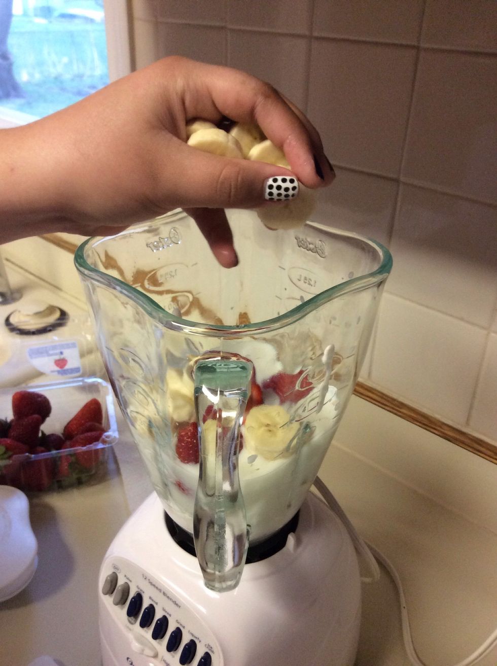 Place your bananas in the blender.