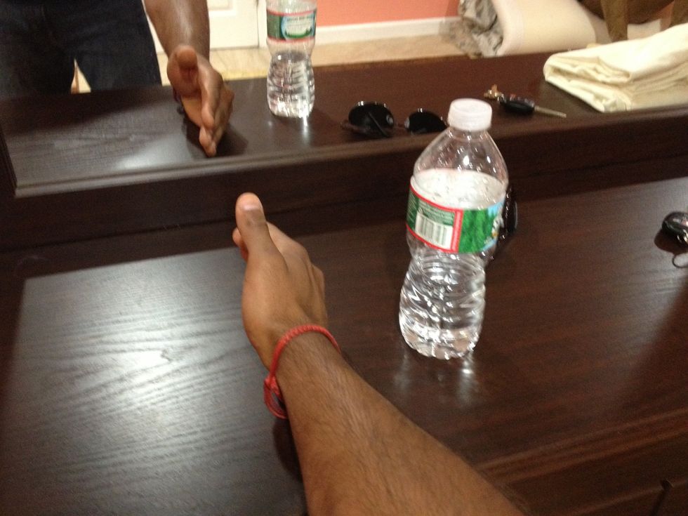 Place your body part of choice on top of the dresser surface