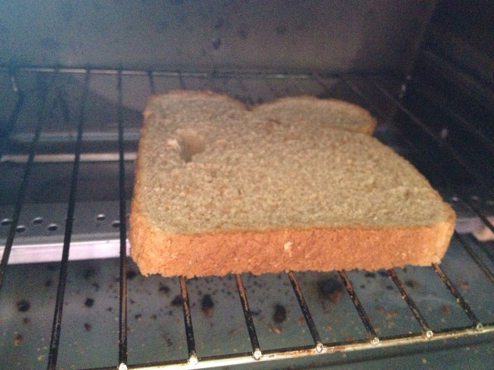 Place your bread in the toaster or toaster oven.