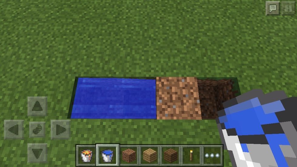 Place your bucket of water on the first gap of the row. It will flow to the second block too.