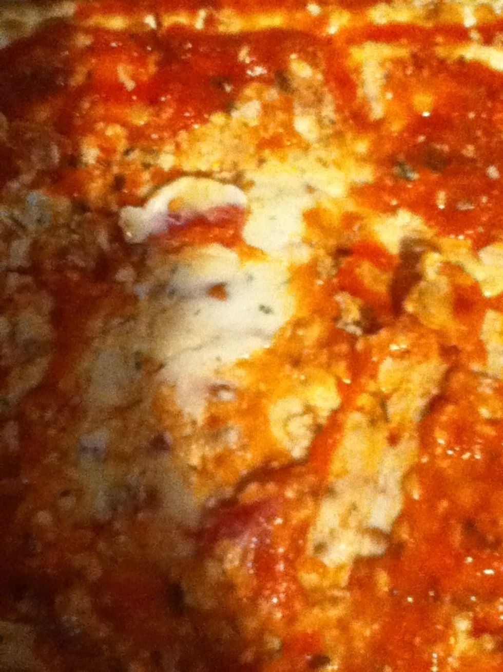 Place your cheese on. If your using a spreading cheese, then spread it on, or if your using the cheese slices out some on top. DO NOT overlap the cheese slices or the cooking time will vary