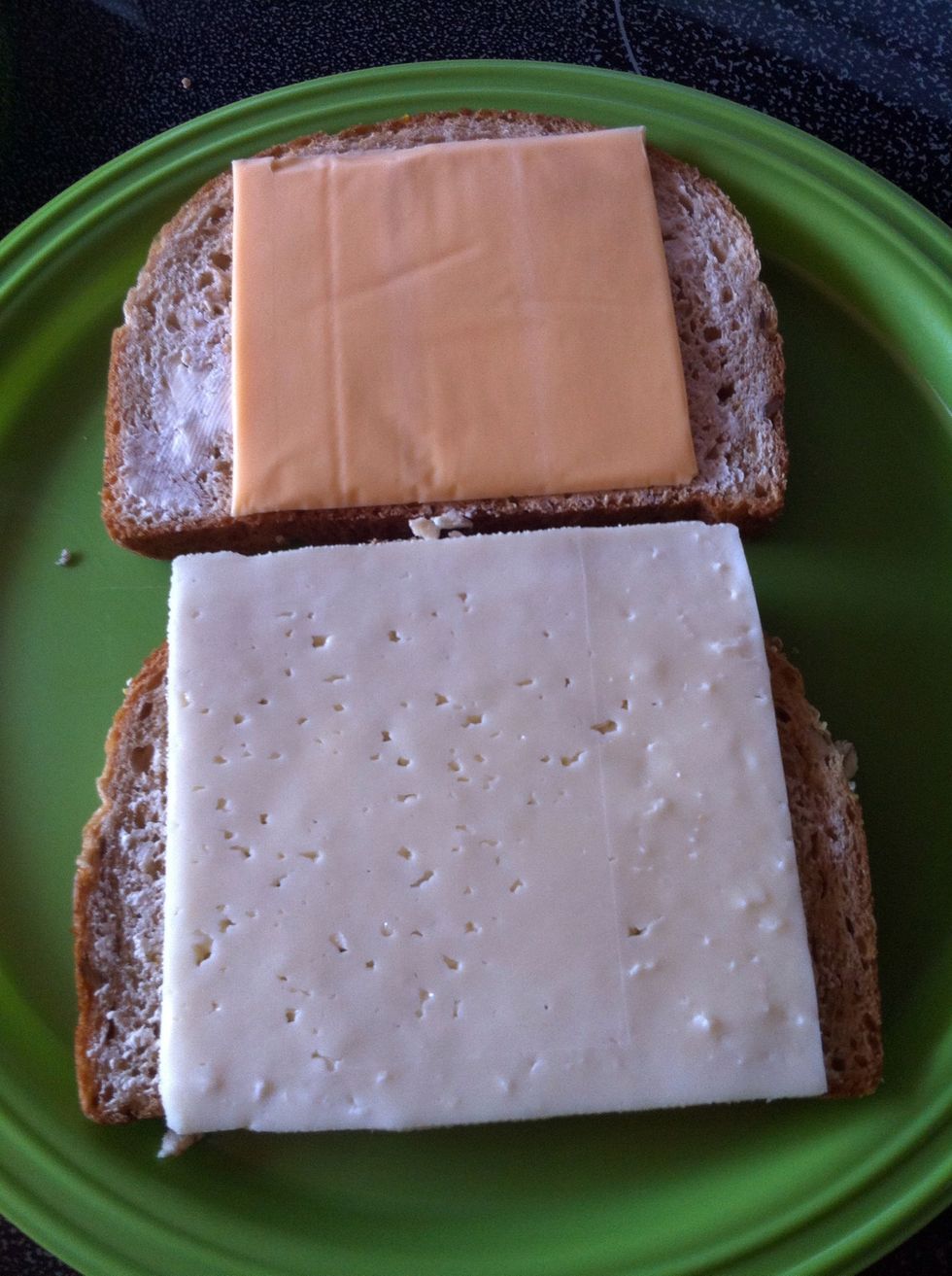 Place your choice of cheese (I picked havarti and regular Kraft cheese) on the thinly spread butter side. I like to put butter on both side. :)