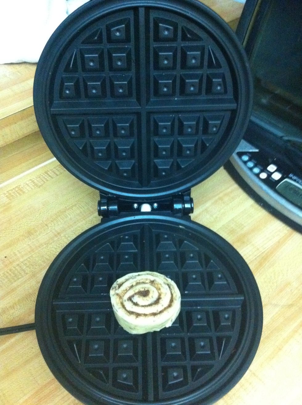 Place your cinnamon roll on waffled maker