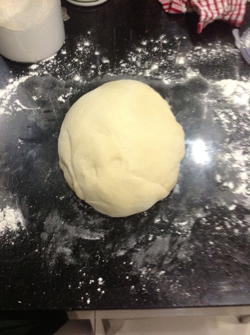 Place your dough and knead it a little by hand. Just until it comes together, like a minute.