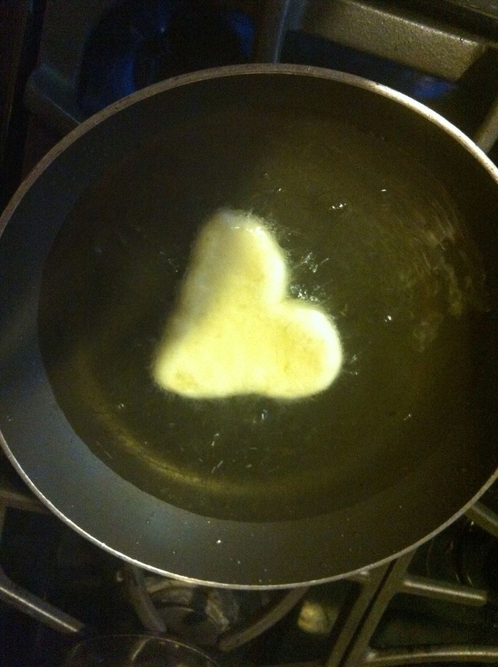 Place your dough in the hot oil, cook for about 1 min on each side or until golden brown. As you continue to fry, the oil will already be hot so time is cut down to about 40 sec on each side.