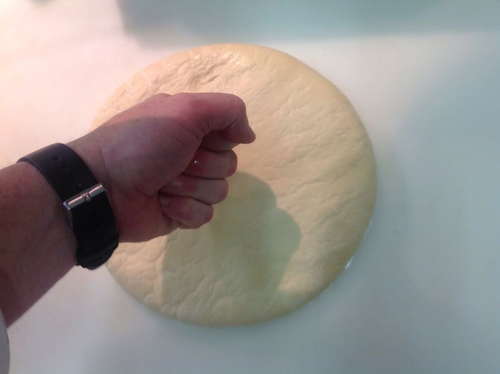 Place your dough on a lightly floured work space & punch down to eliminate air bubbles UNLESS you want them!