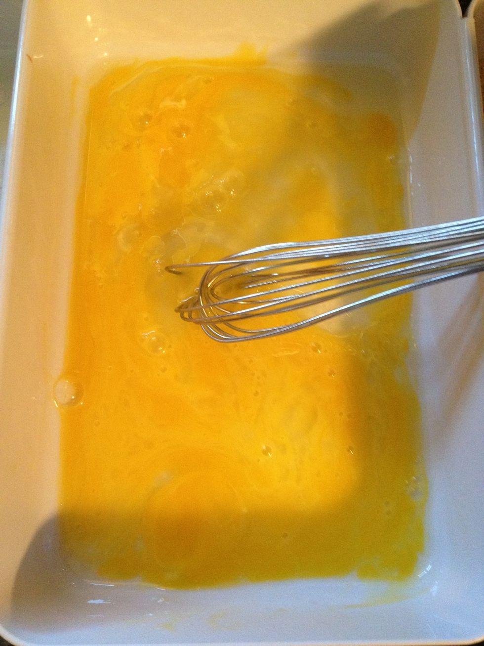 Place your egg in one bowl and scramble it.