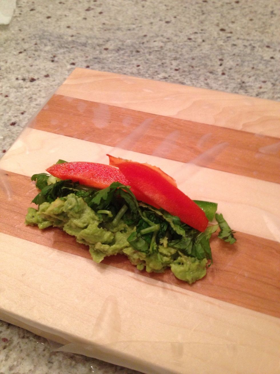 Place your favourite toppings on the rice paper. It is very important not to put too much toppings otherwise will not roll properly.