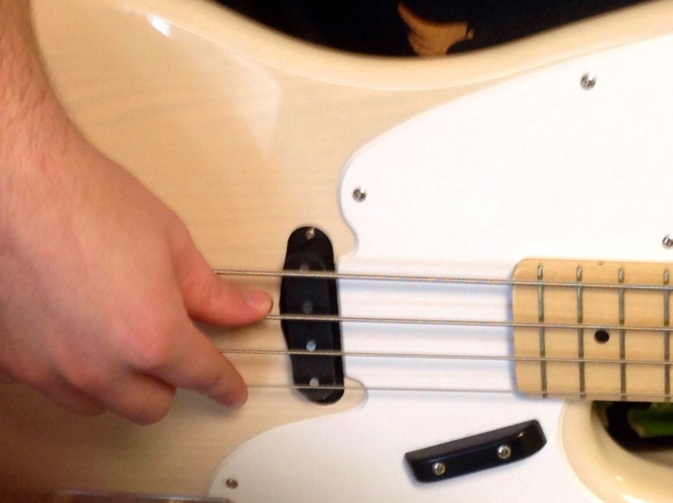 Place your finger on the bottom string, this is the G string.