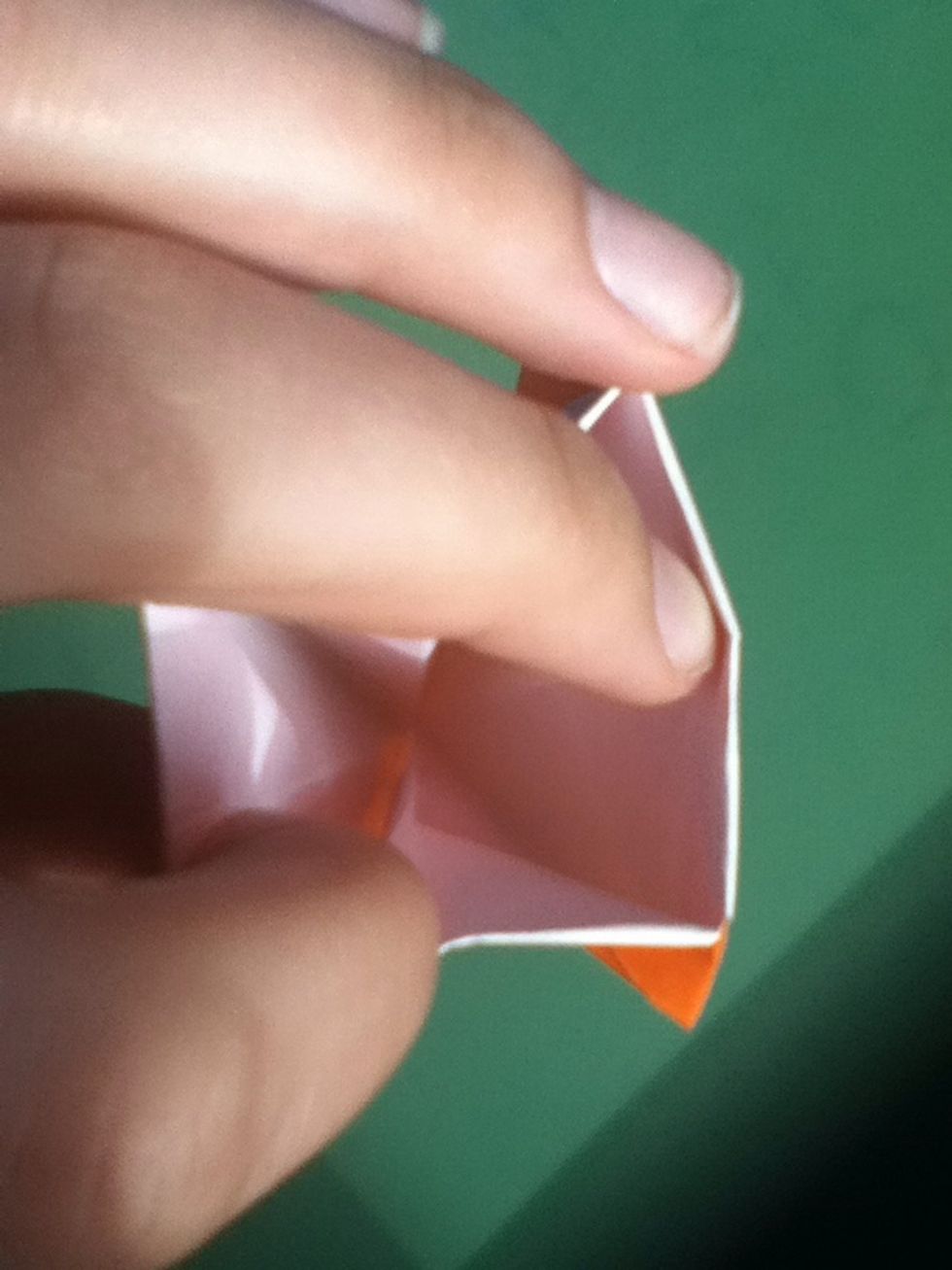 Place your fingers inside the gap at the top and gently open the model